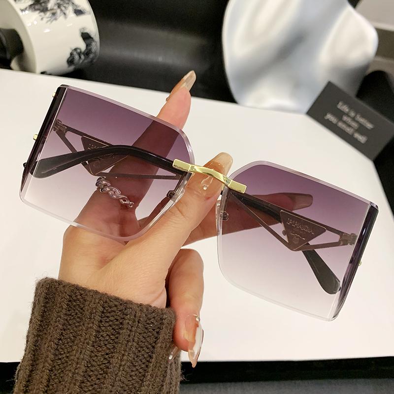 

New Frameless Edge Curved High-end Sense Women s Sunglasses Metal Inverted Triangle Decorative Glasses Men 90310