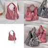 Fashionable Soft Canvas Tote Bag With Spacious Interior And Unique Design