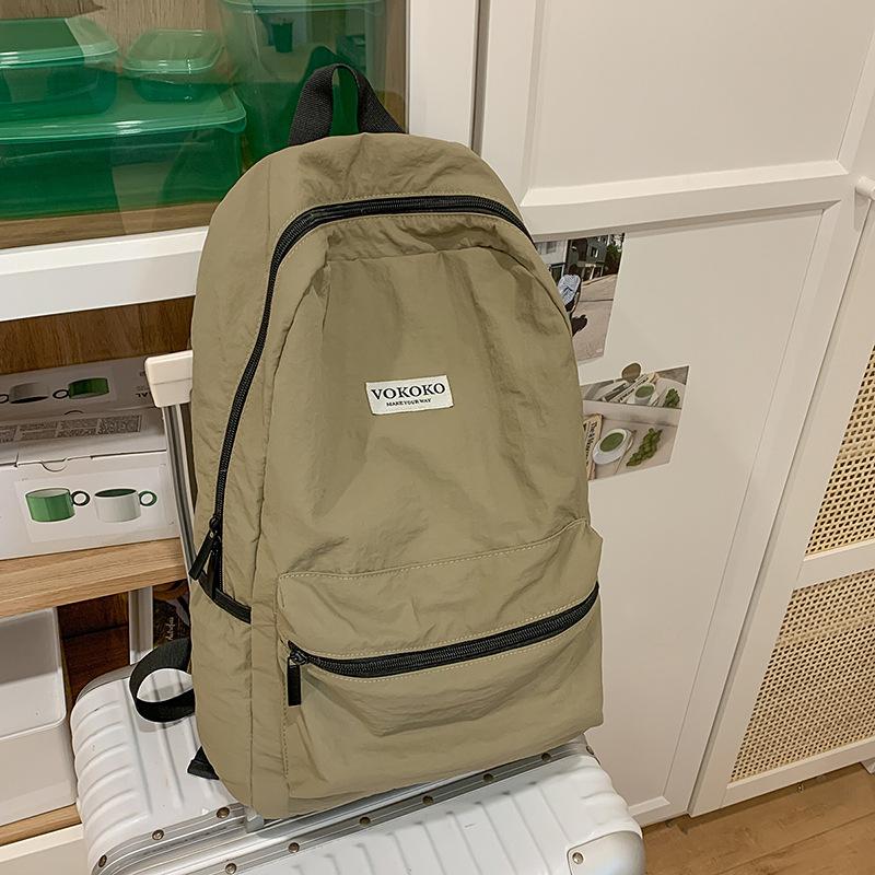 

Lazy wind pendant feeling schoolbag junior high school girls college students high value simple travel backpack lightweight backpack хакі