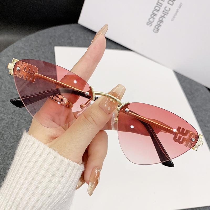 Miao's Frameless Cat-Eye Sunglasses: Women's High-End European & American Style with Hollow Letter Design.
