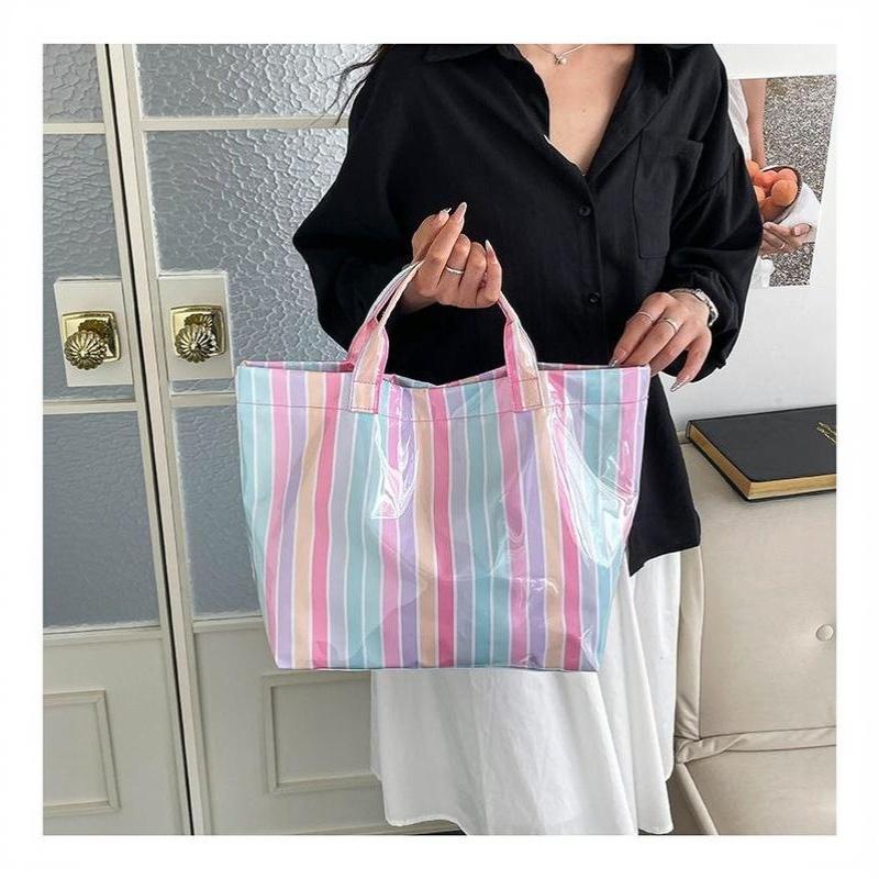 This Water-Resistant Pvc Tote Bag Features A Pink And Blue Striped Design, A Large Capacity, And Is Suitable For Beach Shopping,