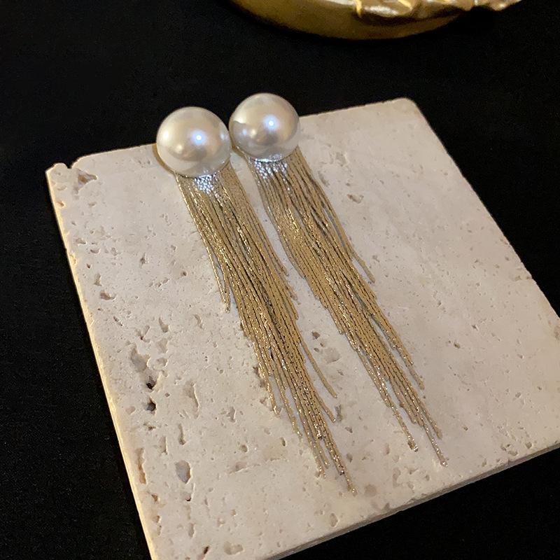 

Silver needle semi-round pearl fringed earrings European and American niche long earrings personalized fashion metal style earrings women