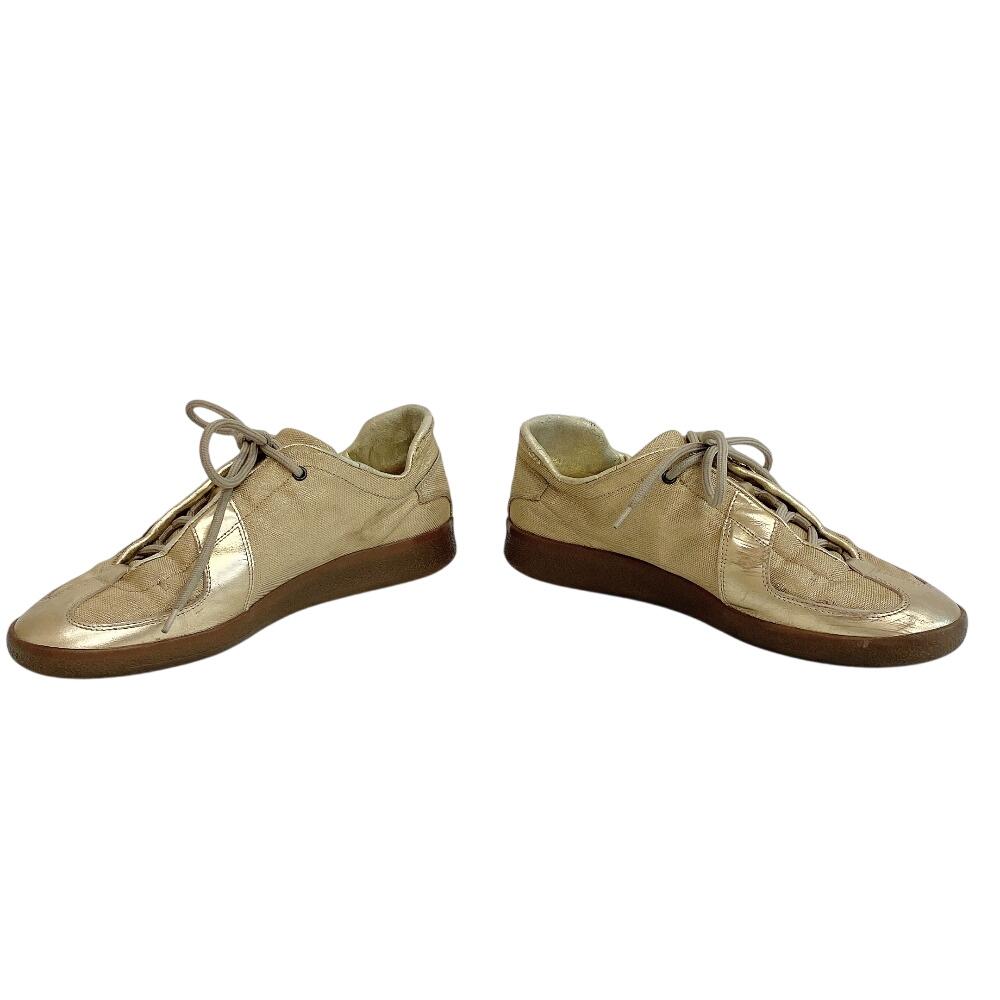 Gucci Niedrig geschnittene Leder-Sneaker goldfarbenes Leder Gebraucht