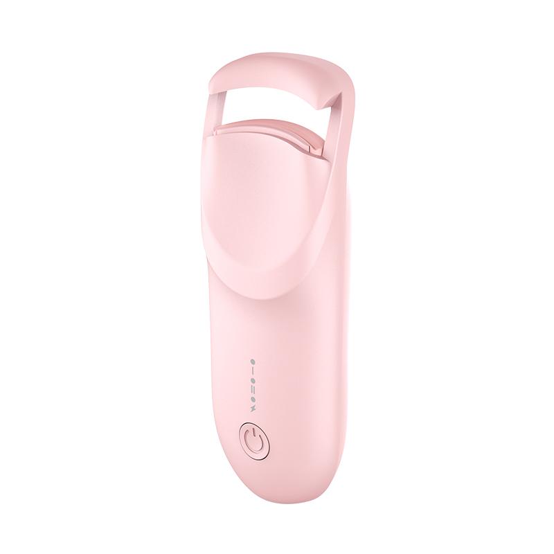 Pink electric eyelash clip, eyelash curler, electric eyebrow trimmer, makeup brush, eye moisturizer spray; beauty products including eyelash curler