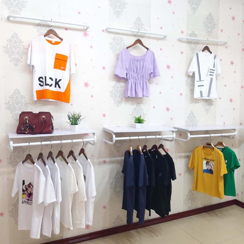 Wall-Mounted Clothing Display Rack for Children's and Women's Apparel