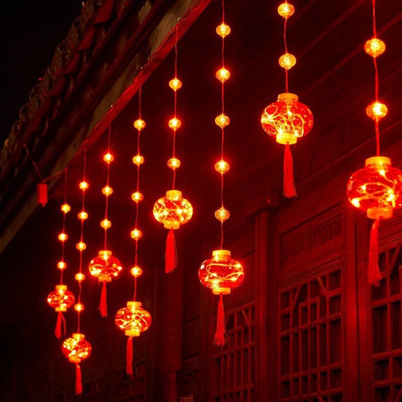 Spring Festival LED Red Lantern Ornaments: Solar Fu Character Colored String Lights for New Year Balcony Decor.