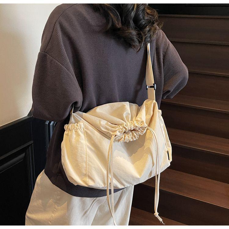 2025 Black Pleated Drawstring Tote - Large Capacity, Versatile Single-Shoulder Crossbody Bag for Casual and Commute Use.