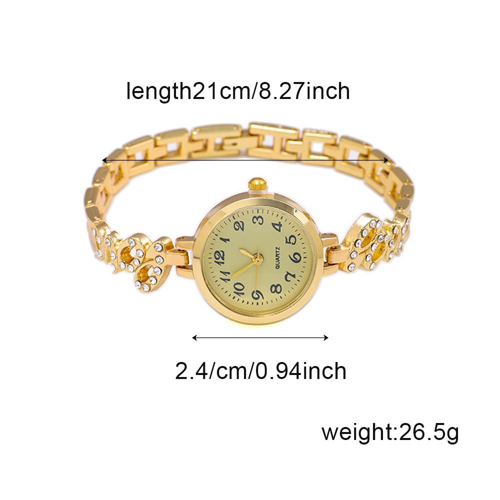 Nové dámské slitinové křemenné náramkové hodinky s náramkem s křídly z plných diamantů