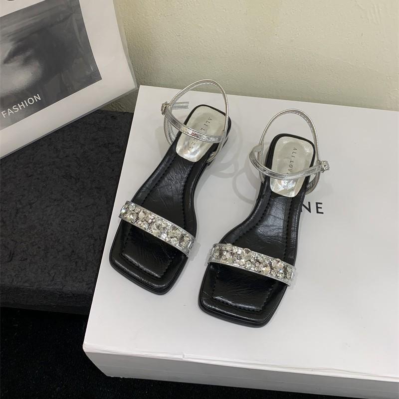 

Summer beautiful silver one-word strap medium thick heel sandals female 2025 new with skirt fairy style French high heels 35