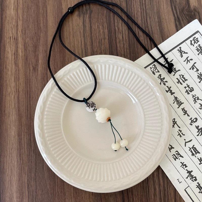 Zen-inspired white jade bodhi lotus pendant necklace for women, new Chinese-style vintage ethnic braided long sweater chain accessory Bodhi Lotus Necklace