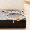 Adjustable Braided String Bracelet with Flower Charm and Star Pendant Suitable for Everyday Wear and Gift Giving