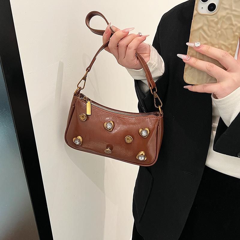 Woman Bags bag 2025 new Korean version of fashion rivets personalized trend women's shoulder crossbody armpit bag