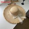 Cappello estivo in paglia di rafia a tesa larga con motivo geometrico per la spiaggia e le vacanze