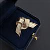 Gold plated alloy knot shaped brooch with neutral and cool style, fashionable and simple women's accessories