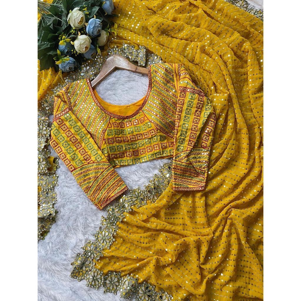 Lanzando un hermoso sari de fiesta de color amarillo con trabajo de espejo de diseño
