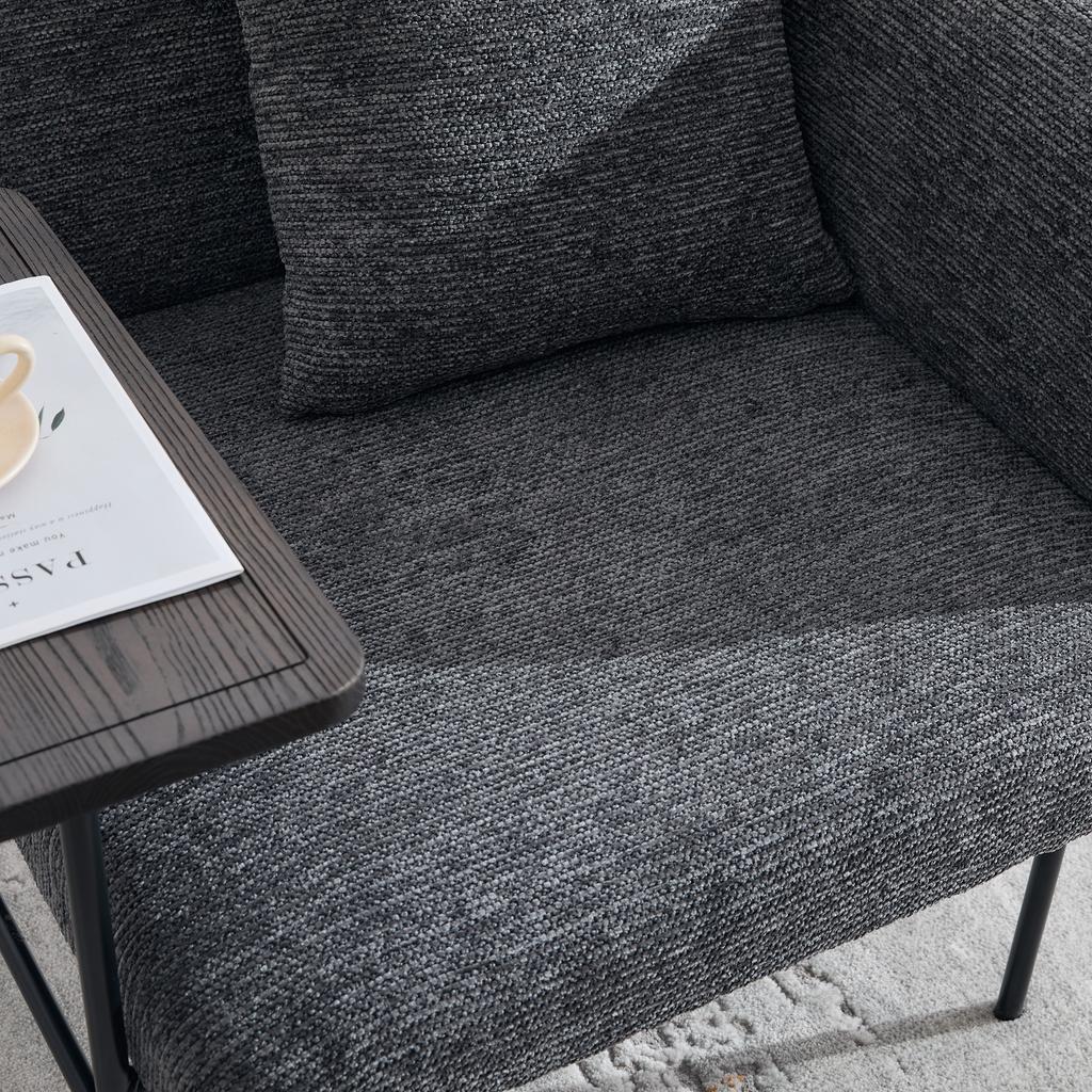 Modern single armchair with comfortable fabric backrest and two storage compartments, complemented by a practical side table.