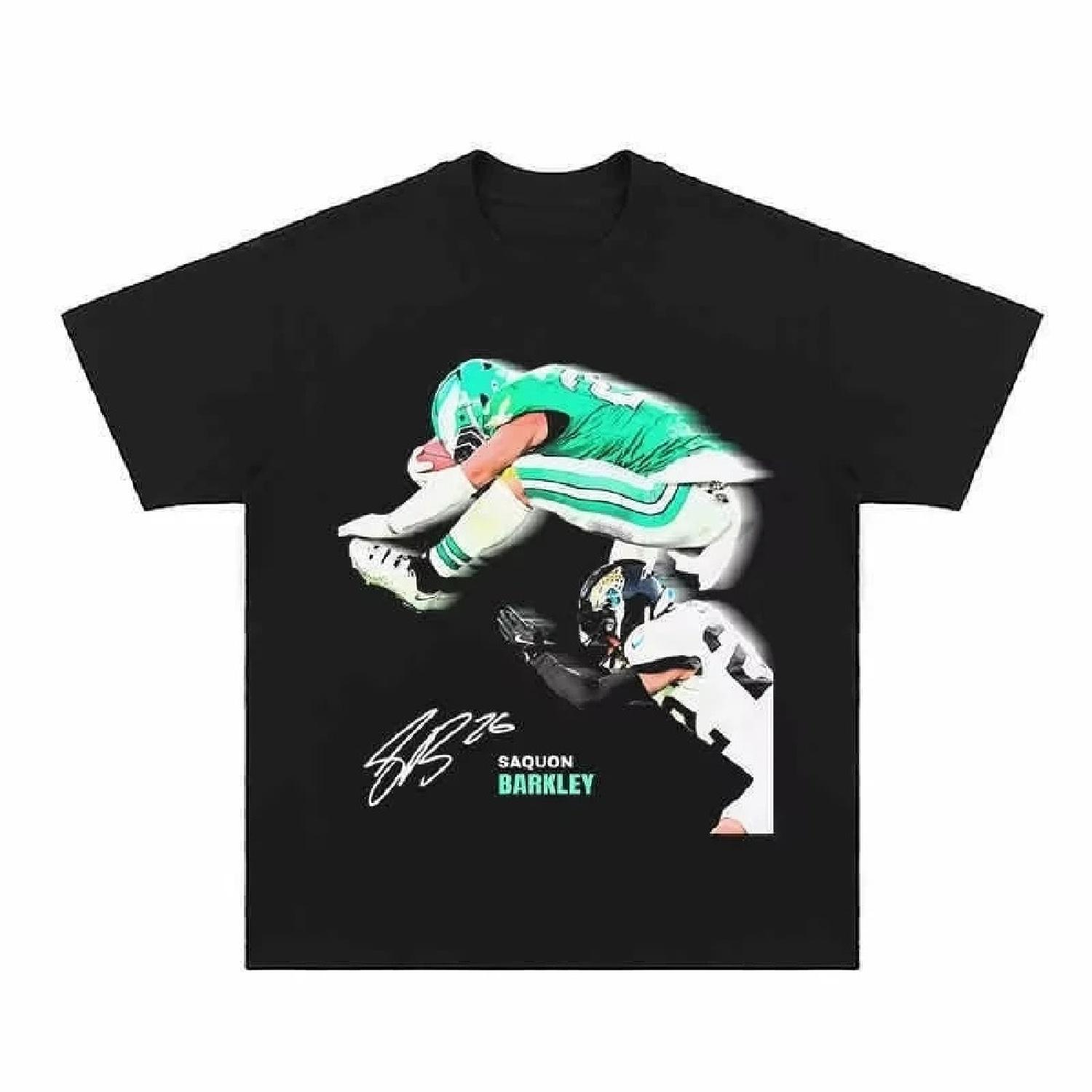 

A Flying Scene of Saquon Barkley in NFL Football T-shirts Men s Women s Casual Short Sleeve Crew Neck Cotton Tee Unisex Fashion XXXXXL різнокольоровий