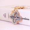 Exquisite Four-Leaf Clover Alloy Keychain Charm - Perfect Gift for Girlfriend, Bag Accent, or Keyring Accessory.