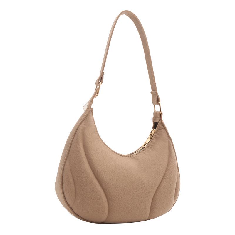 This Year's Trendy Women's Minimalist Dumpling Bag - a New Korean-style Shoulder Bag with Niche Fashion and Elegant Underarm Design.
