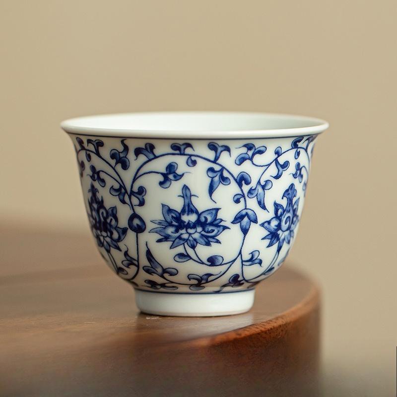 Handmade pressed hand cup blue and white host tea cup Kung Fu tea set guest cup entwined lotus tea cup tea set ceramic 70ml