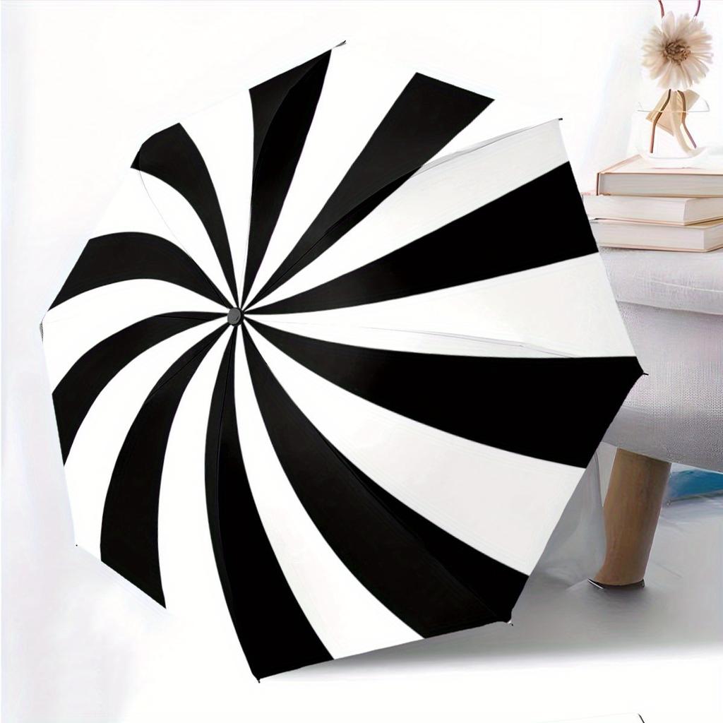 A Black And White Spiral Patterned Automatic Folding Umbrella. It Features a Portable And Collapsible Design, Making It a Casual Outdoor Acc