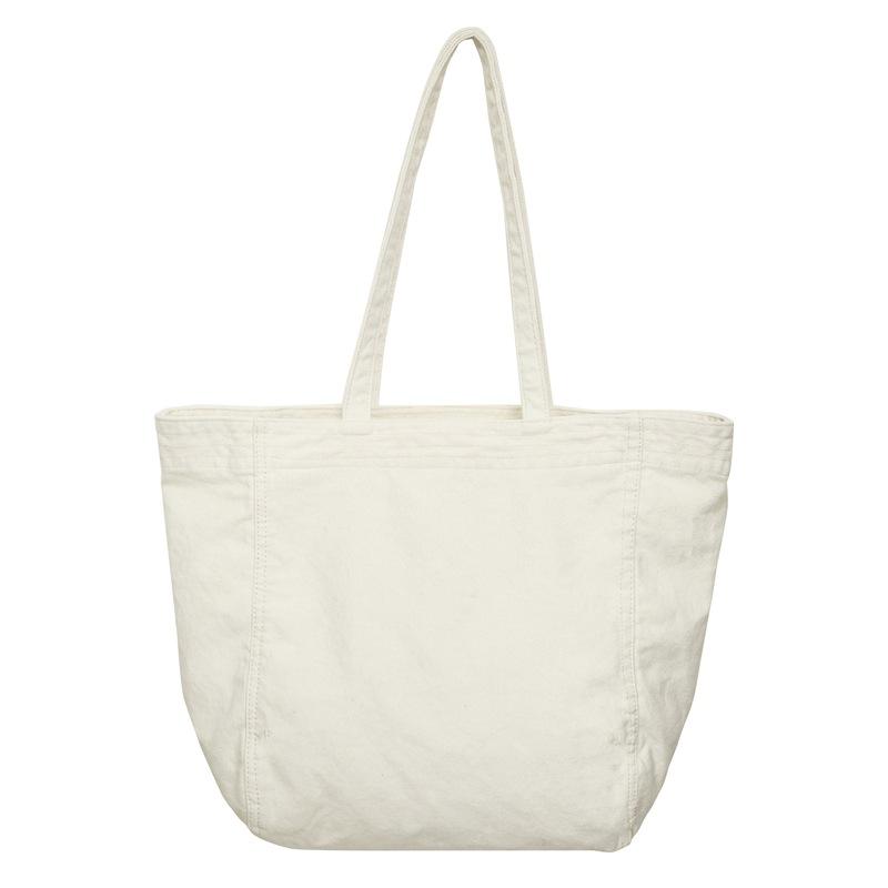 Lazy wind canvas bag, new large-capacity commuter tote bag, casual versatile shoulder bag, portable shopping bag.