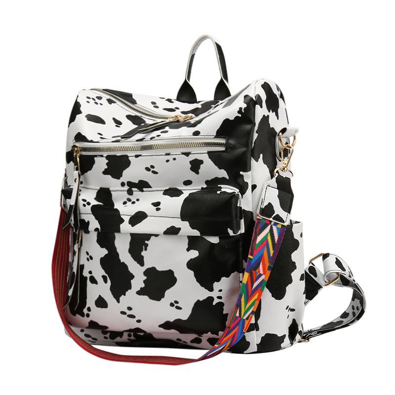 Neuer PU Retro Rucksack mit großer Kapazität für Reisen, Kuhmuster, schlichter britischer Stil, schräg über die Schulter tragbar, für Damen
