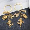 Antique Gold Western Cowboy Hat and Boots Keychain Ornament