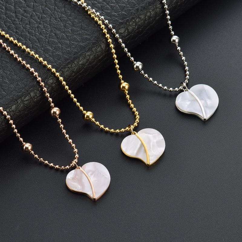 Elegant Gold Titanium Steel Women's Necklace with White Shell, Zircon, and Monogram Tassel