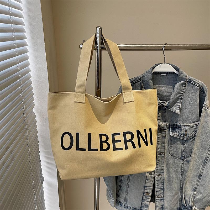 

Women s bag 2025 summer new fashion simple canvas bag shopping bag letter foreign style tote bag portable shoulder bag хакі