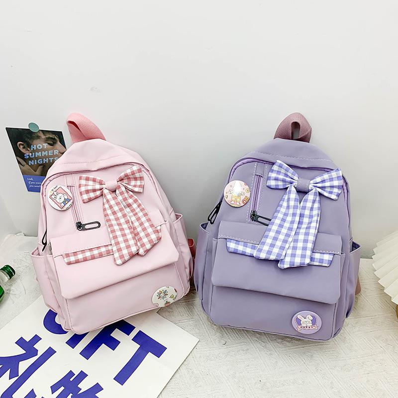 Bow schoolbag Female primary school students Large capacity 3rd to 6th grade high school lightweight weight weight reduction Cute simple backpack
