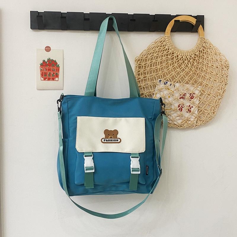 

2025 новый студент колледж простая литературная и досуговая наплечная сумка тренд контрастный цвет медведь косметичка one size fits all синий