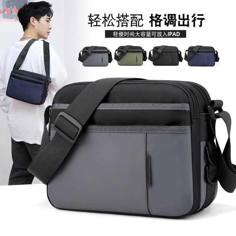 

20 New Oxford cloth backpack men s lightweight mailman shoulder messenger bag portable travel bag men s bag tide He is a size 10.