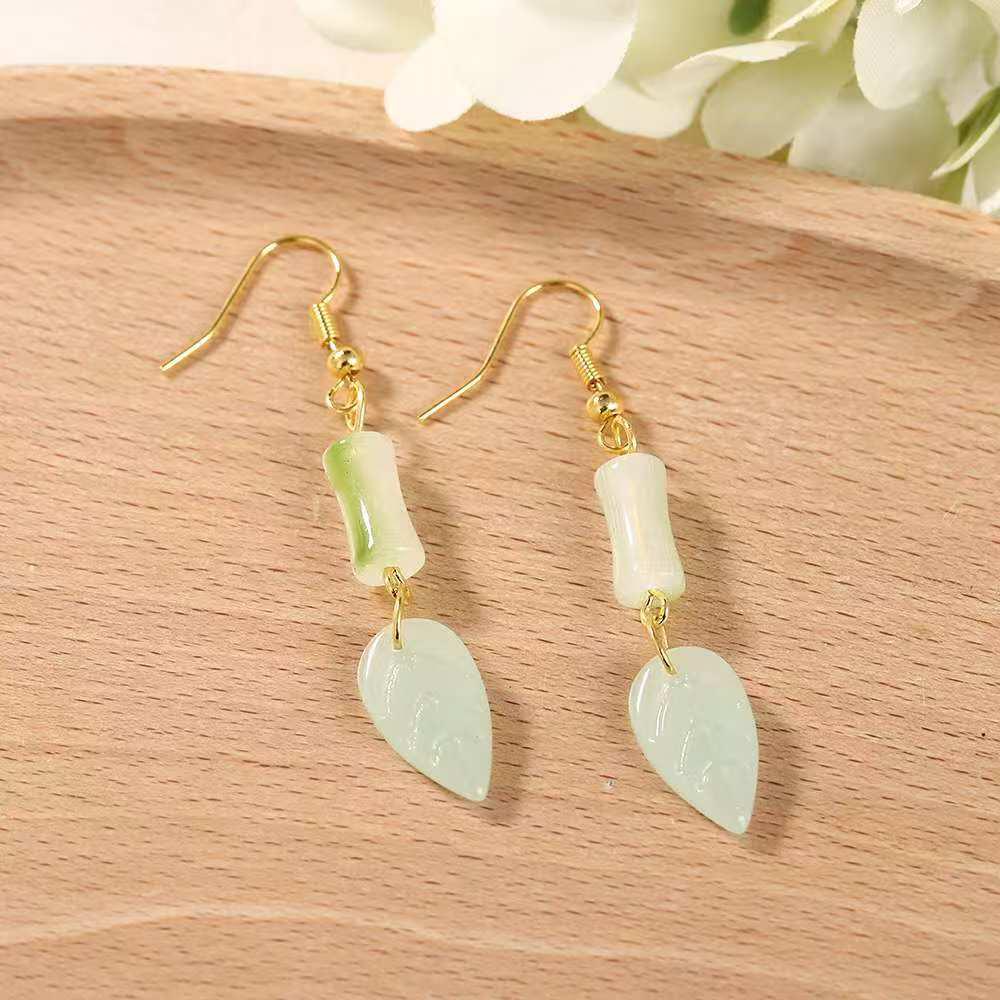 

Chinese Bamboo Leaf Dangle Earrings: Luxurious, Elegant, and Unique Design.