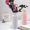Nordic Style Round Plastic Vase - Fashionable, Simple, Anti-Fall Porcelain Imitation for Home Decoration and Flower Arrangements.