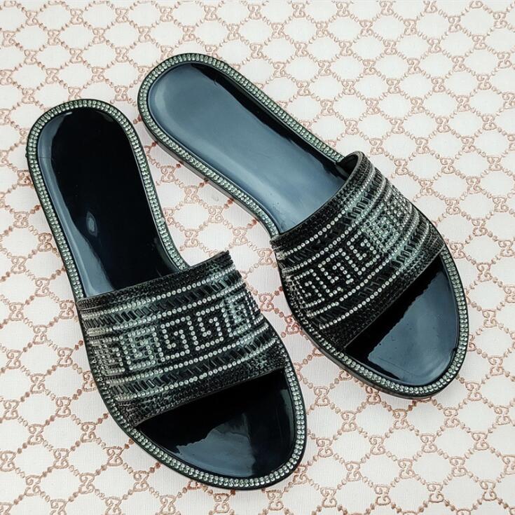 

Мода 2025 женские новые домашние шлепанцы с круглым носком на плоской подошве, украшенные бриллиантовыми пайетками, с надписью, желе, прозрачного цвета, повседневные домашние сандалии/шлепанцы 38 чёрный