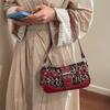 Boucle de ceinture rétro imprimé léopard sac à bandoulière tempérament nouveau mode printemps et été rivet grande capacité décontracté sac d'aisselle