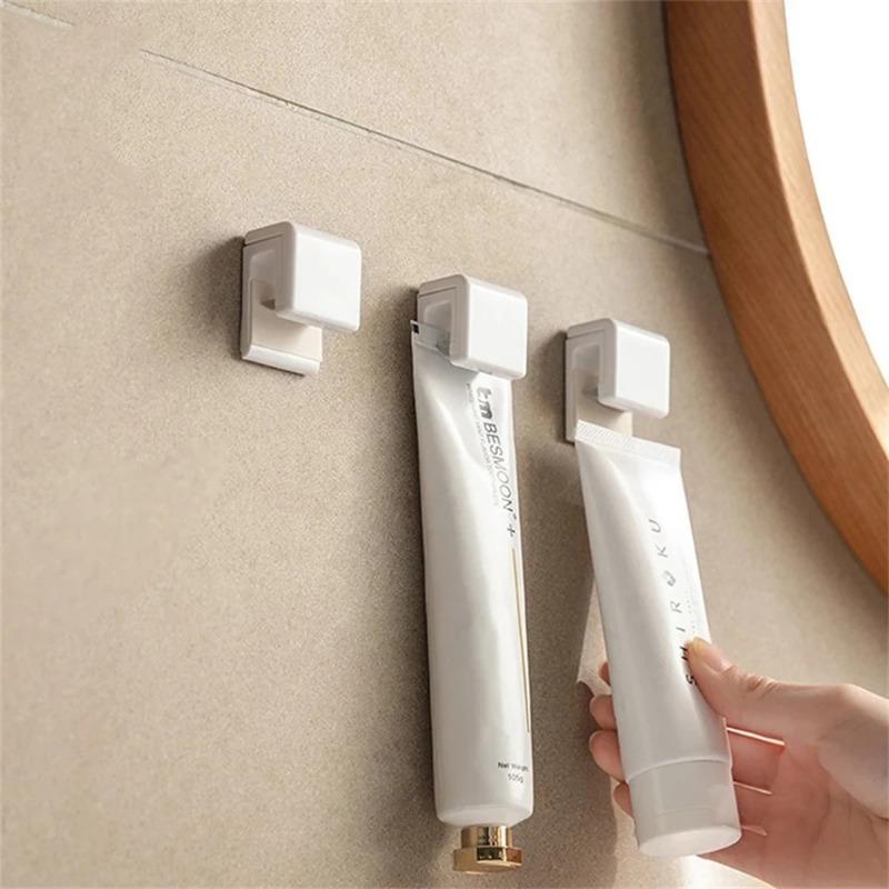1pcs Toothpaste Storage Clip Non-marking Toothpaste Cleanser Rack Bathroom Hanging Clip Cleanser Clip Bathroom Accessories Hanger