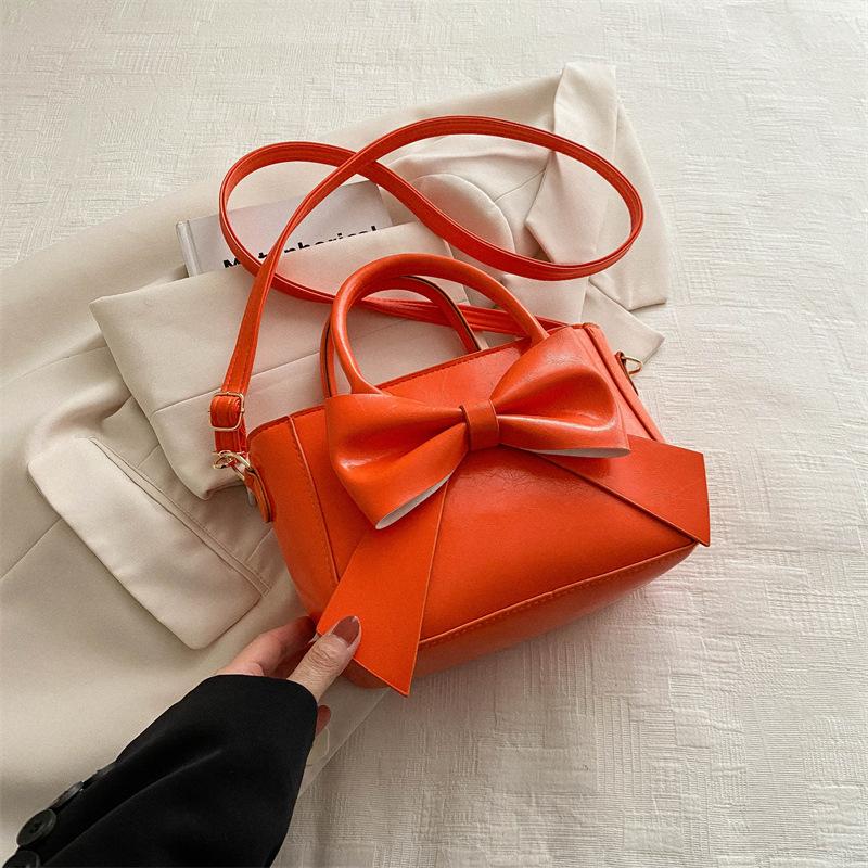 

Bow fashion foreign gentle handbag 2025 spring new versatile ins shoulder messenger bag small square bag помаранчевий