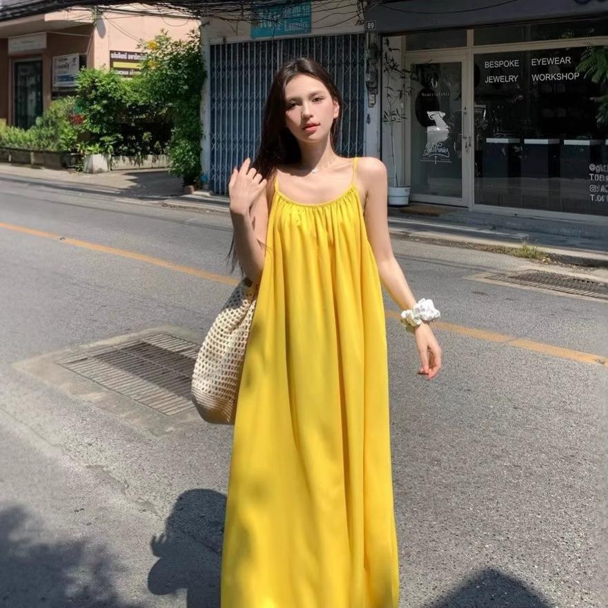 Seaside vacation sexy backless suspender dress women's summer new loose a-word skirt gentle yellow long skirt