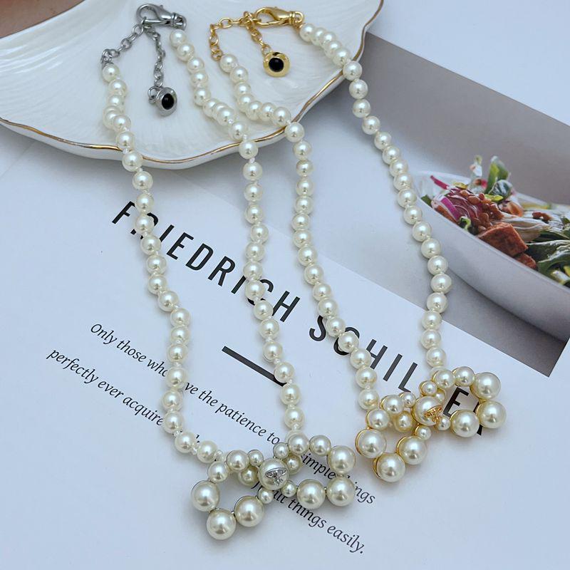 

Retro Style Pearl Saturn Bowknot Necklace for Women золотой