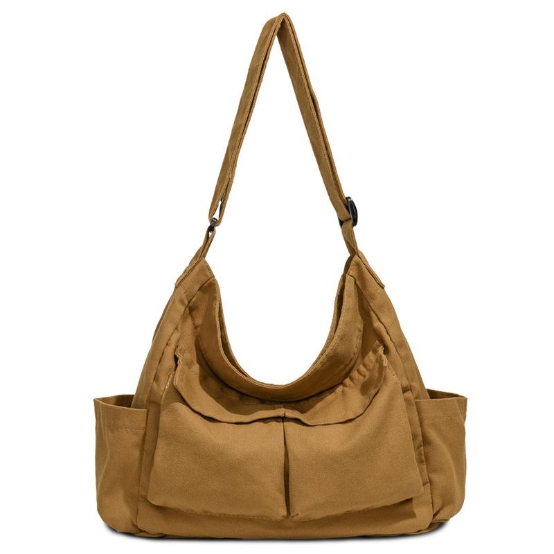 

Retro neutral style canvas messenger bag 2025 autumn new Japanese large-capacity campus shoulder messenger tote bag коричневий