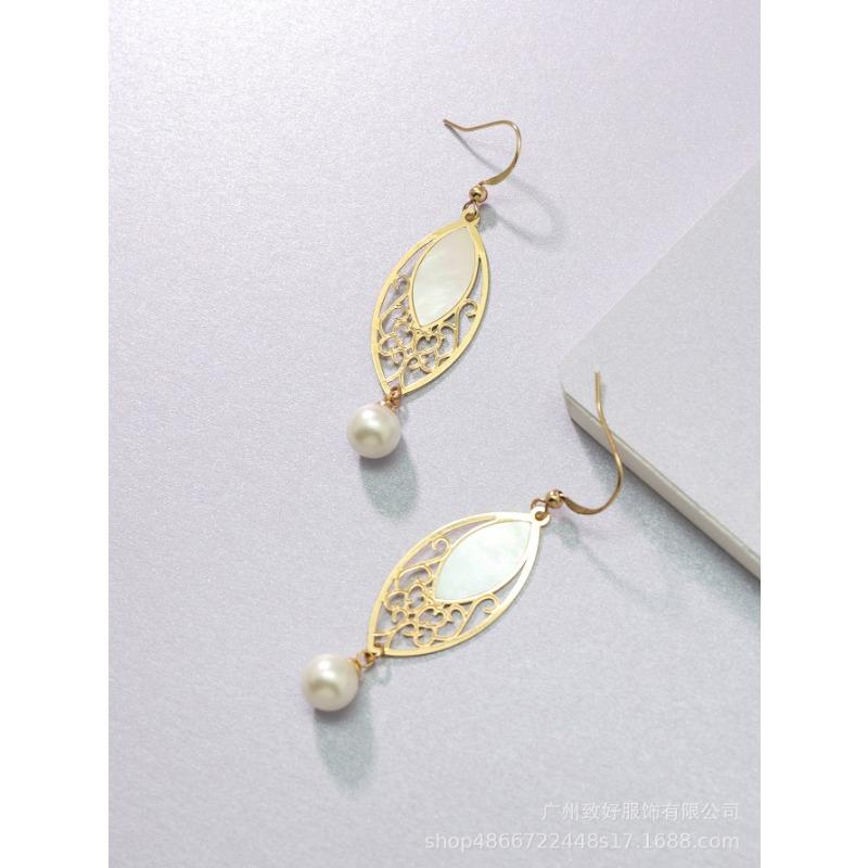 

Преувеличенные атмосферные серьги-ракушки с модными овальными жемчужинами 14k