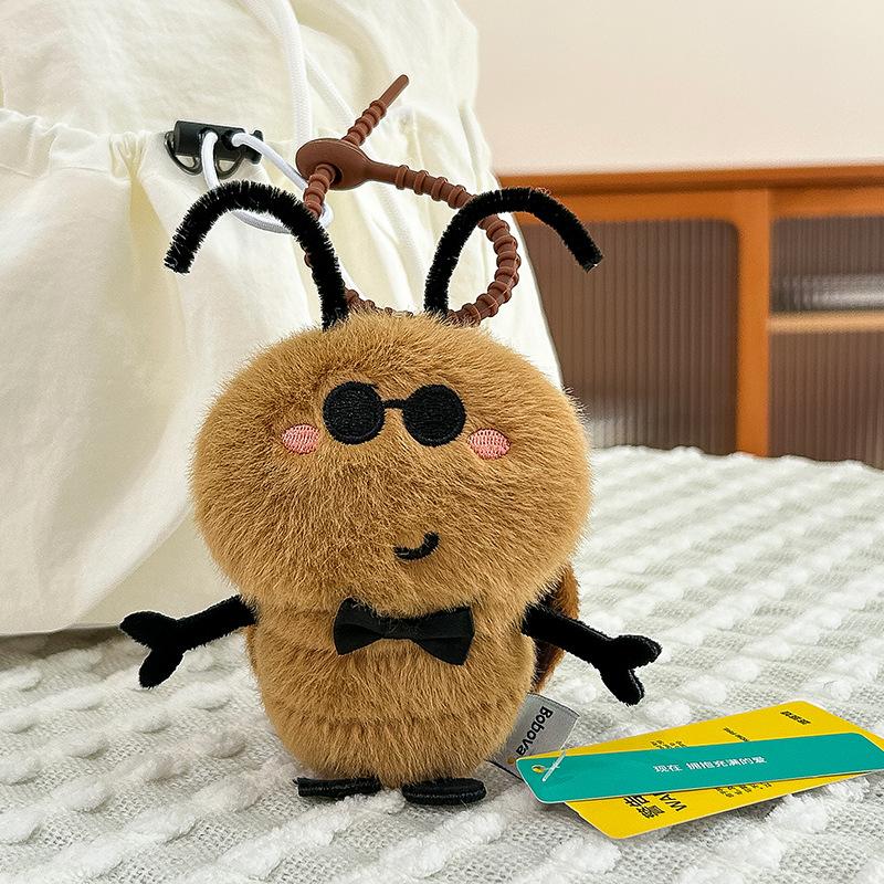 

Genuine cute cockroach doll plush pendant funny DTY tentacles small strong keychain schoolbag pendant doll 10cm (0.03kg)