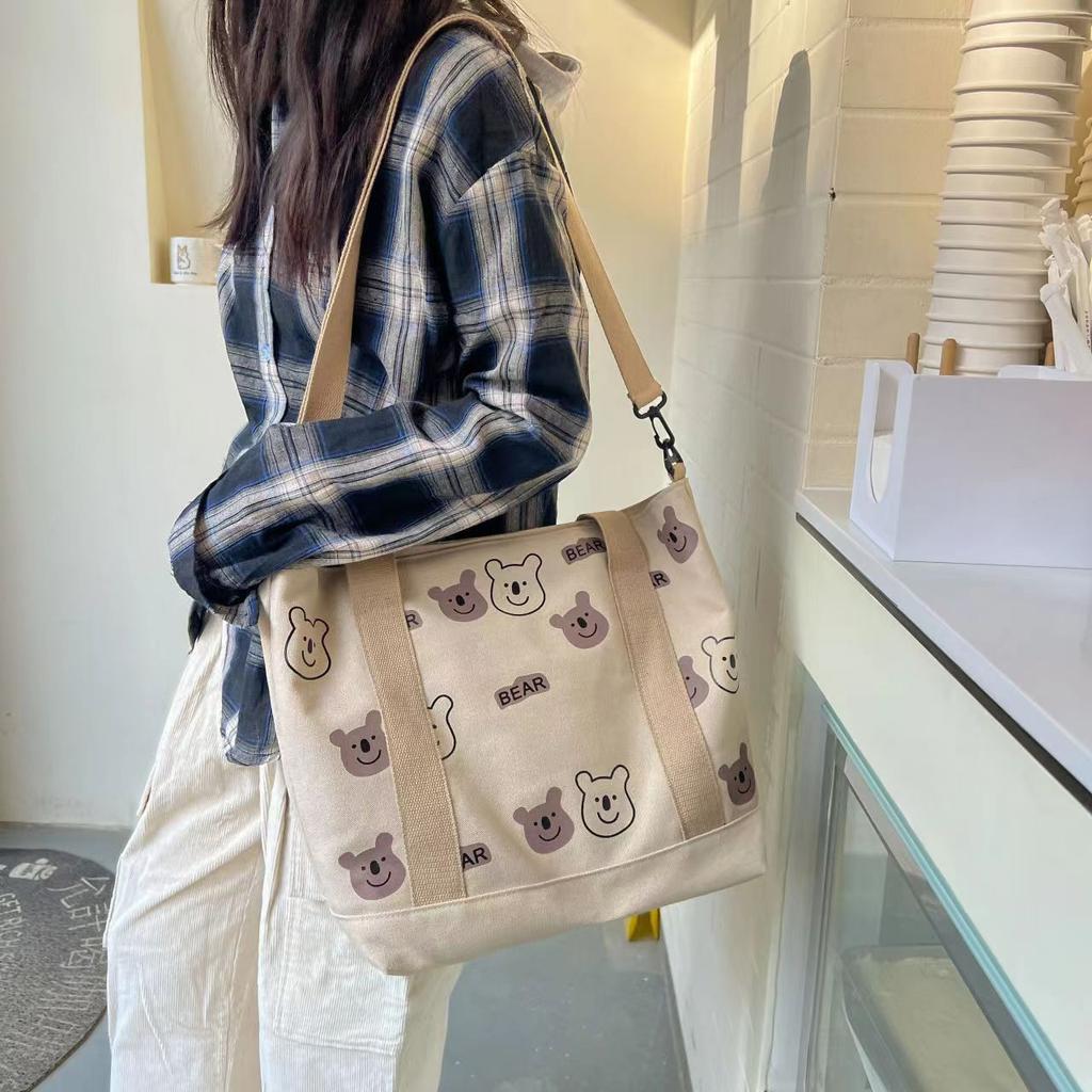 Large capacity versatile canvas shoulder bag bag female student make-up bag portable shopping bag cute AB bear bag