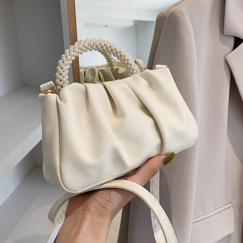 Solid color women's bag, summer new cloud bag, fashionable softfaced portable small bag, simple foreign style single shoulder oblique span bag