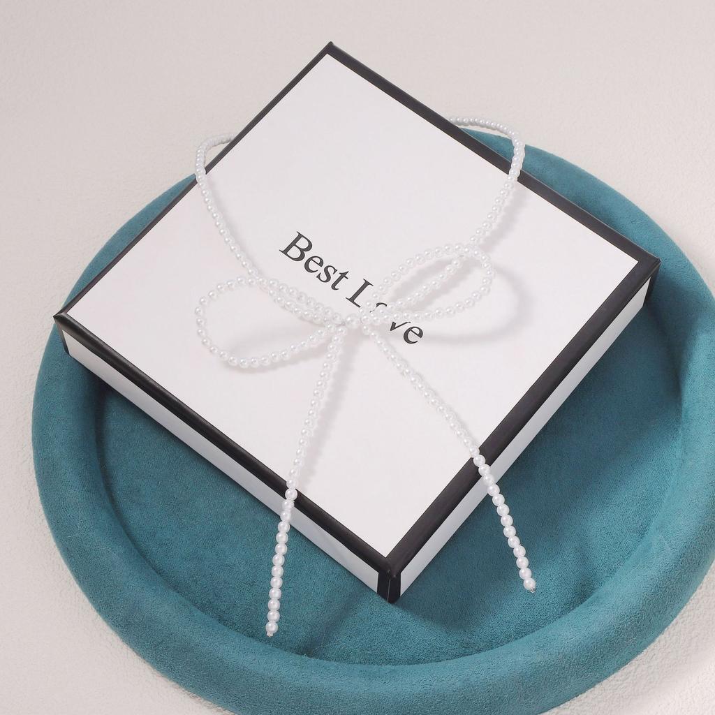 Korean version of simple niche imitation pearl fugitive princess bow necklace clean super fairy ballet style collarbone chain