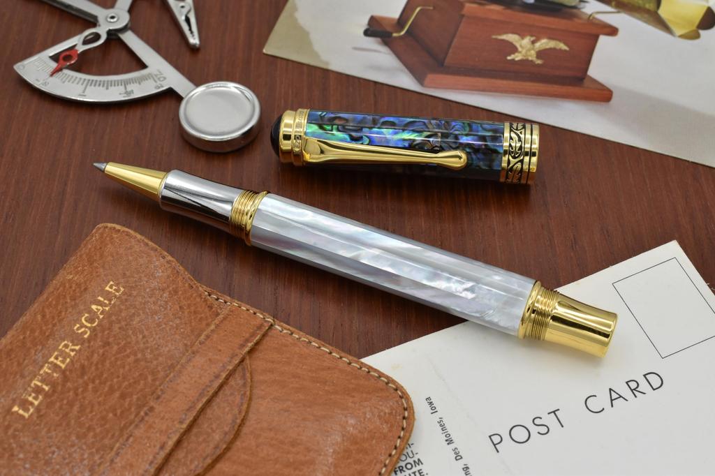 Xezo Maestro Oceanic Origins Iridescent White and Blue Paua Shell Rollerball individually 18K platinum No two pens are Mother-of-Pearl Pen, numbered.