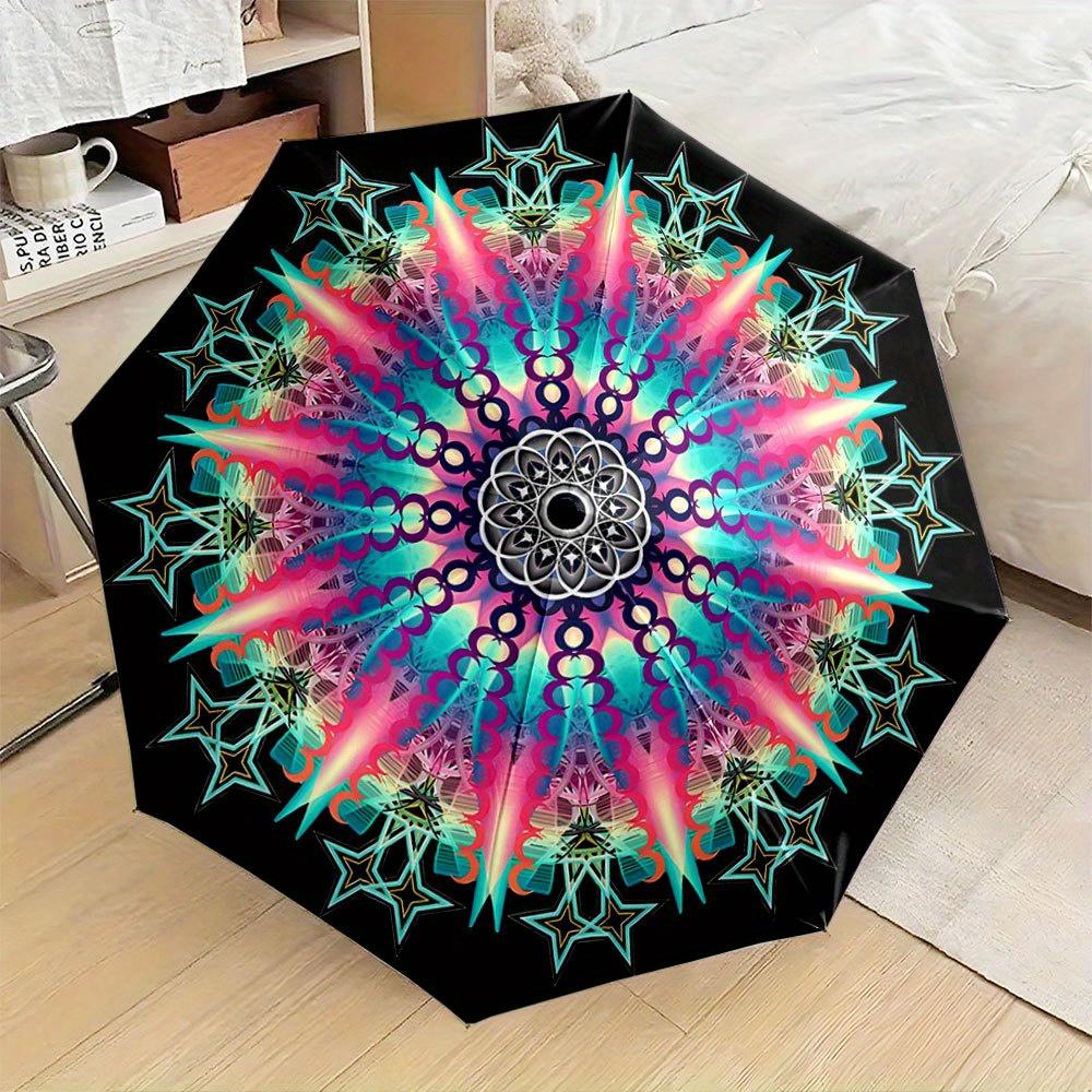 

Folding Umbrella The umbrella displays vibrant patterns with concentric circles and radiating star motifs, resembling a kaleid