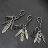 Distinctive Feather Keychain Charm In Antique Silver With Turquoise for Individualistic Fashion Statements Pieces